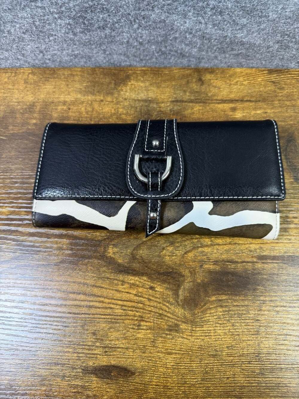 Black and Brown Animal Print Trifold Wallet with Silver Buckle Detail